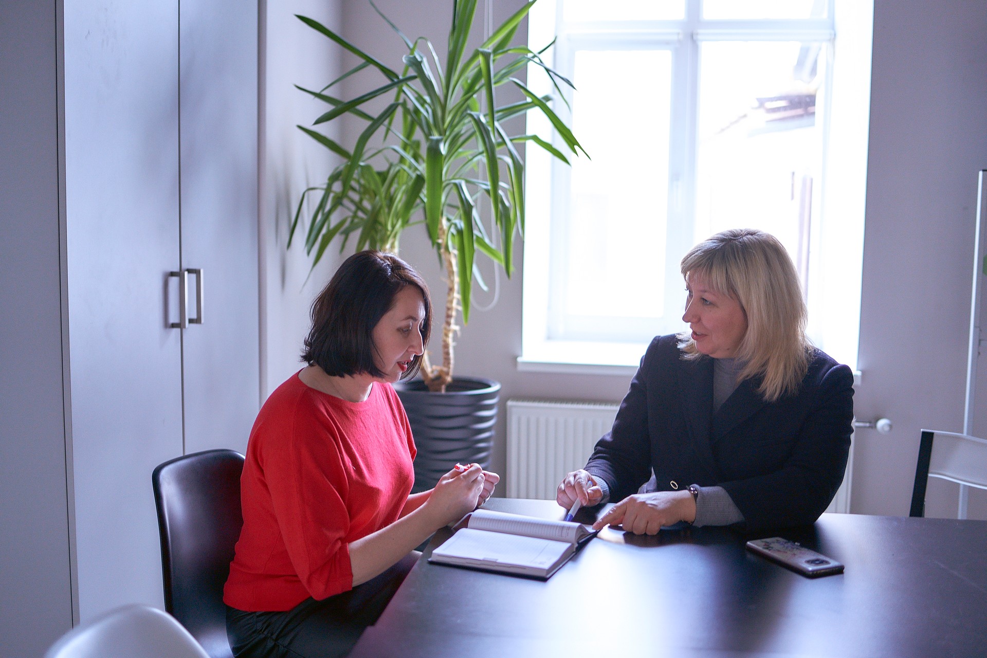 a woman receives employment advice from hr in the office